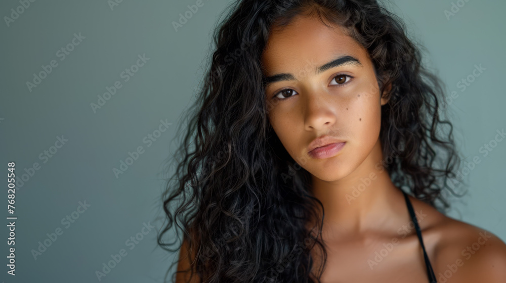 Head and shoulders studio portrait of a beautiful Brazillian teenager. Head and shoulders studio portrait of a beautiful Brazillian teenager.