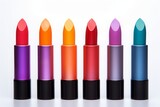 set of lipsticks, several lipsticks of different colors in a row on a white background