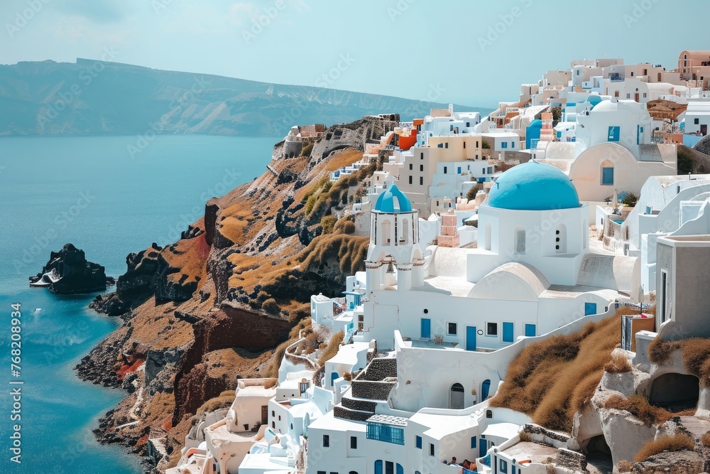 A stunning photo capturing a village with white and blue houses situated precariously on the edge of a cliff, A Grecian white and blue cliffside village, AI Generated