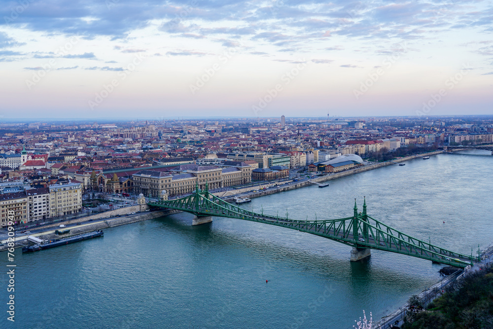 Danube river with Liberty bridge or Freedom bridge in Budapest, embankment with city panorama