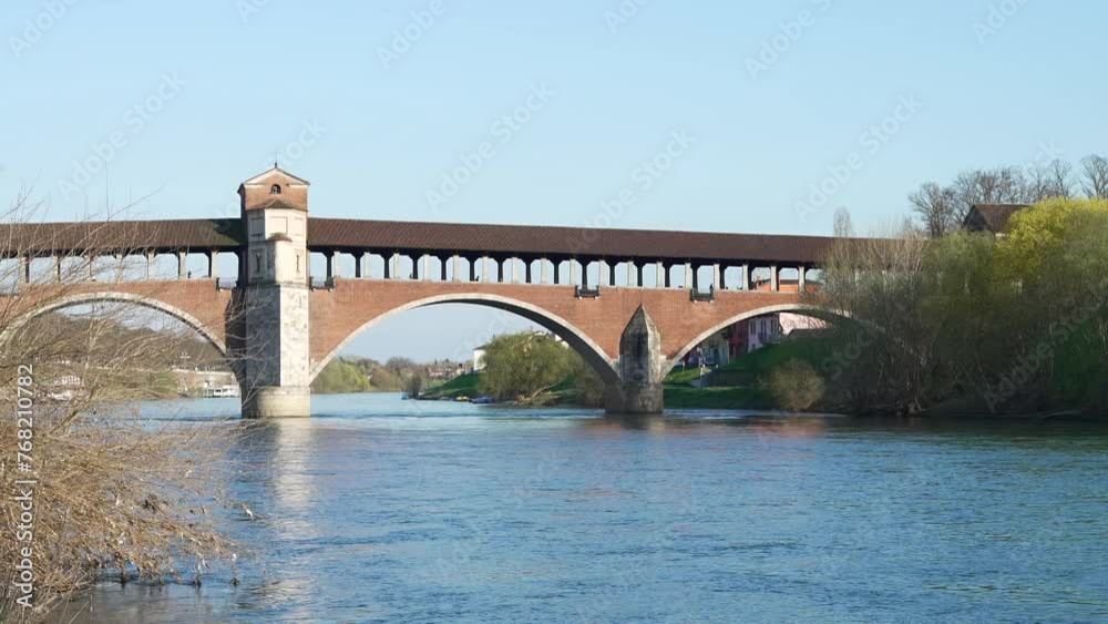 Nice view of Ponte Coperto (covered bridge) is a bridge over the Ticino river in Pavia at sunny day, Lombardy, Pavia, Italy Nice view of Ponte Coperto (covered bridge) is a bridge over the Ticino river in Pavia at sunny day, Lombardy, Pavia, Italy