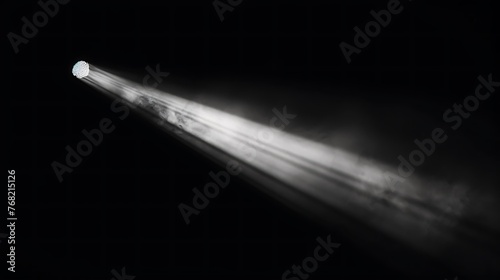 Bright white spotlight with smoke and fog on a black background.