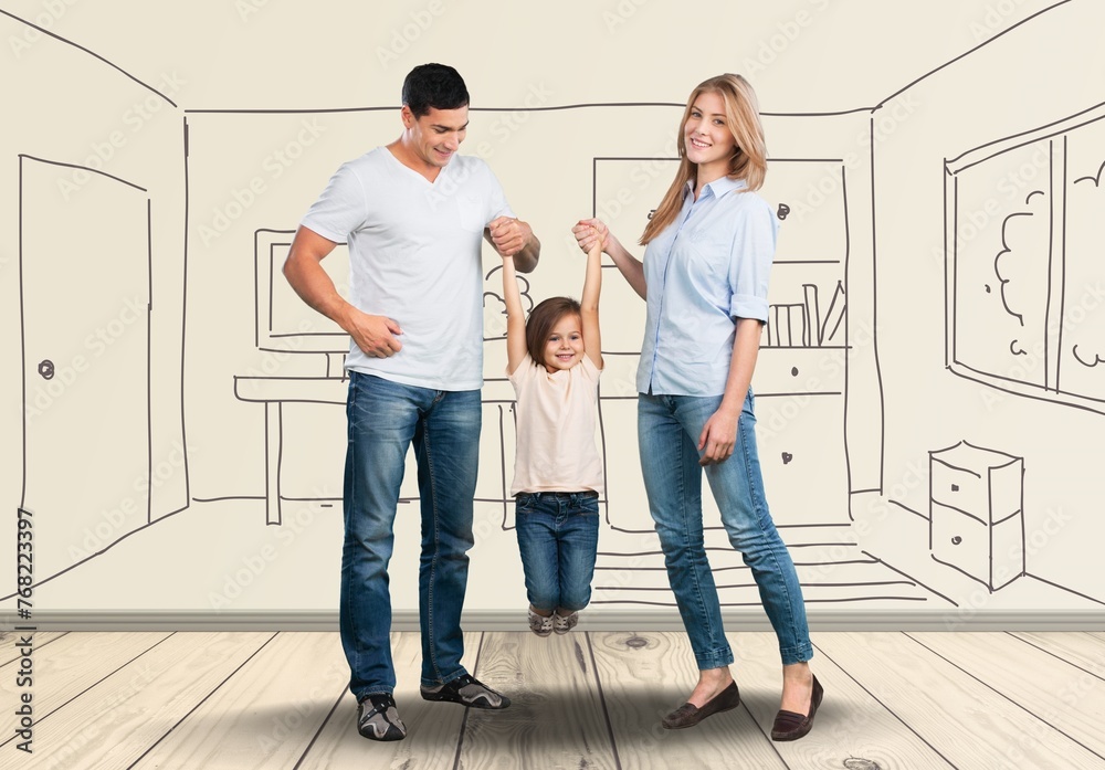 Cheerful young parents with child enjoy room interior Cheerful young parents with child enjoy room interior