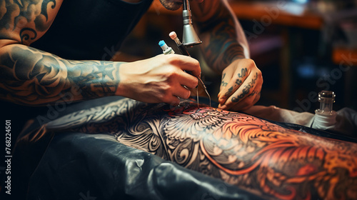 Tattoo master makes tattoo on the stomach of a young man