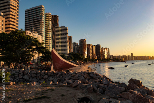View of the buildings on the edge of Iracema beach, Fortaleza, Ceará, northeastern Brazil, with the sunset light reflecting on the facades photo