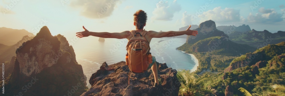 Obraz premium Tourist athlete rejoices climbing a mountain in a tropical country, success and goal achievement concept, man raised his hands up in delight, banner