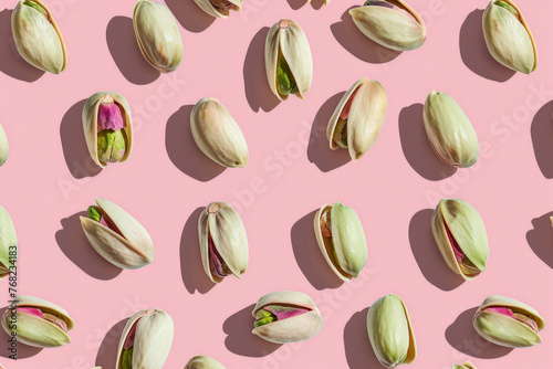 Creative pistachio pattern featuring humorous shadow play on minimalist pink backgrounds. Ideal for wallpapers, textile prints, and product branding.