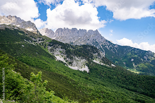 Bergwanderung durch Almen und Bergwald zur Gruttenhütte am Wilden Kaiser oberhalb von Elmau in Tirol photo