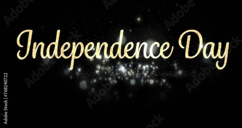 Digital image of gold Independence Day text in cursive with white shiny lights appearing against bla