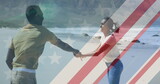 Image of american flag over african american couple dancing at beach