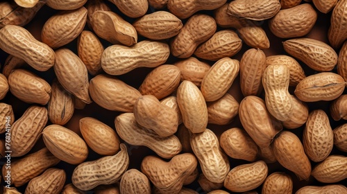 Peanuts on a brown background. Close-up. Top view.