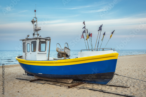 Fishing boat on Baltic Sea beach in Karlikowo District in Sopot city, Poland