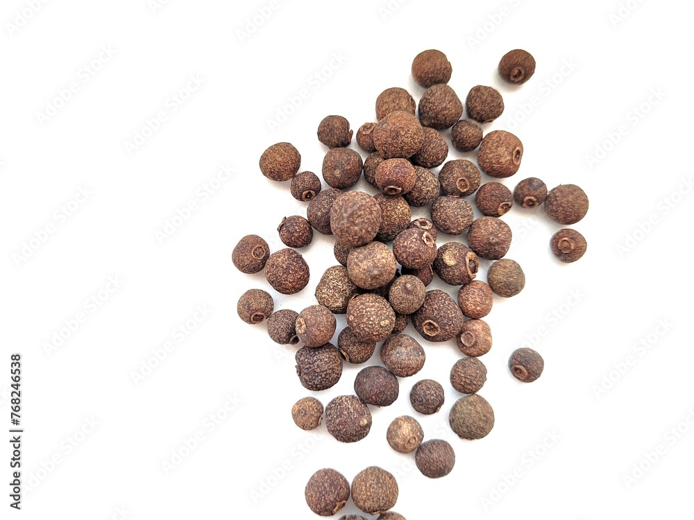 Allspice berries on a white background. Allspice berries on a white background.