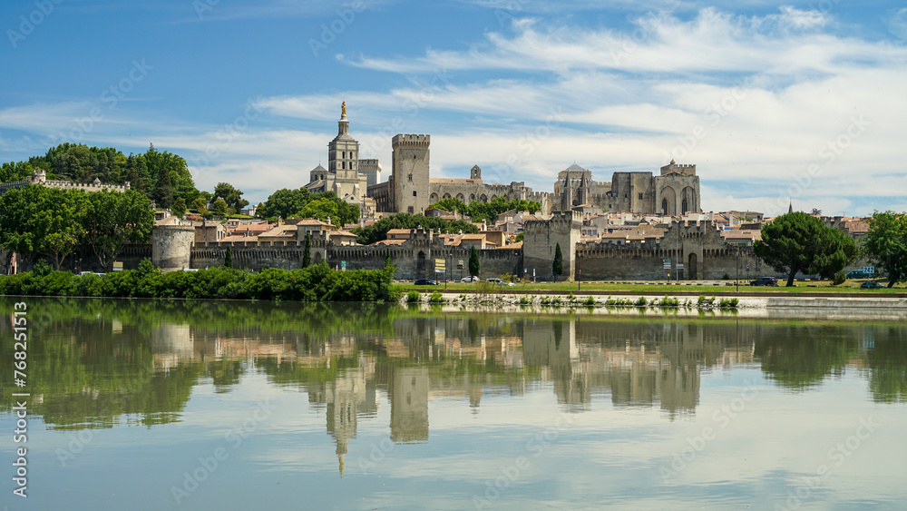 Avignon historic town mirroring in Rhone River, popular tourist landmark, Provence, France