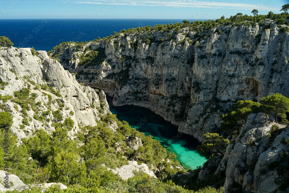 Calanque d'En-vau remote beach with turquoise water surrounded by cliffs, beautiful summer swimming and relaxing spot, aerial view, Calanques National Park, Provence, France