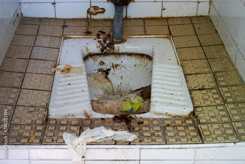 Obraz na płótnie Disgusting dirty wc squat toilet in french city Avignon, France w salonie