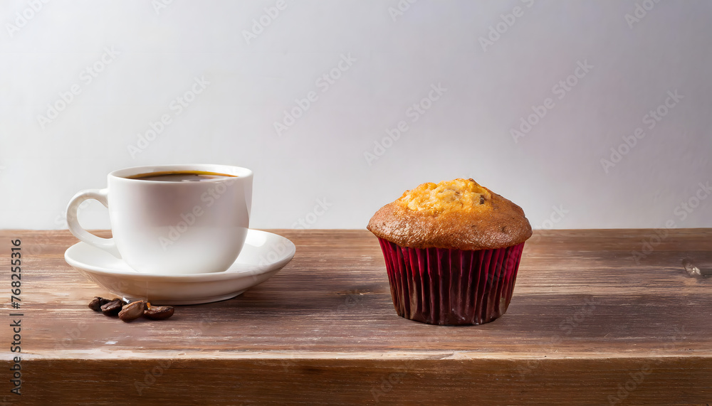 Cup of coffee and muffin on a wooden table. with coffee beans. Breakfast snack. Cup of coffee and muffin on a wooden table. with coffee beans. Breakfast snack.