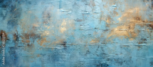 A detailed painting in shades of blue and gold adorns a wall, with intricate brushstrokes creating a textured surface. The colors blend seamlessly, enhancing the cracked and peeling grunge background.