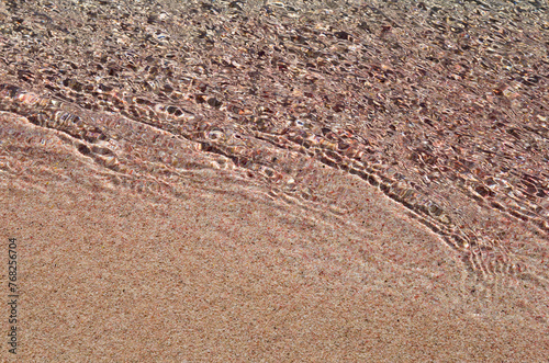 Wave on pink sand beach, background