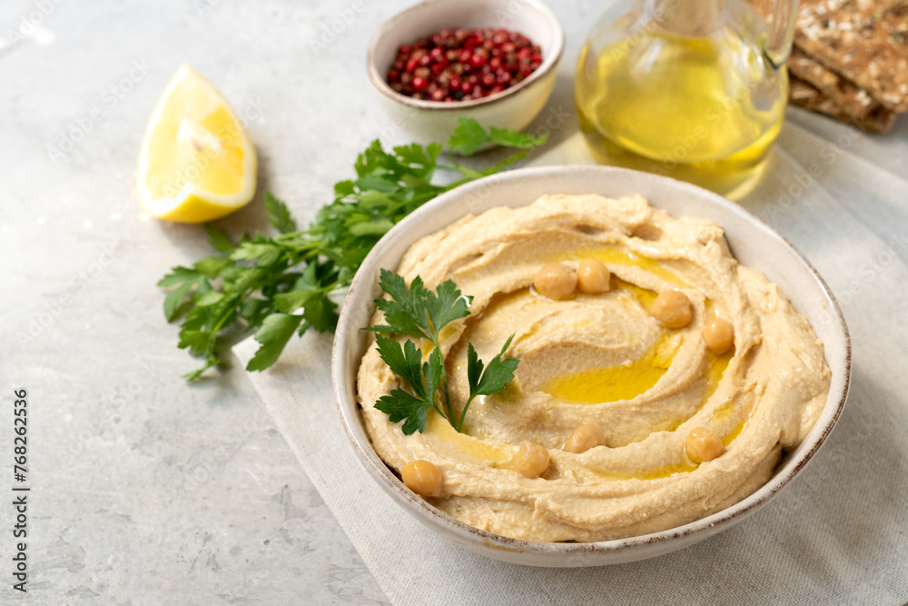 Fresh hummus with chickpea olive oil and limen with multigrain crackers