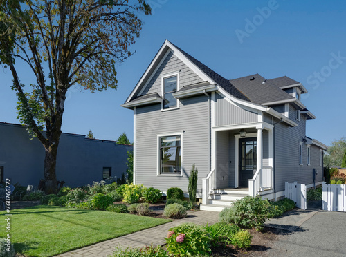 Nestled in Oregon's serene landscapes, this cozy traditional cottage is surrounded by lush shrubbery, offering a tranquil haven away from the hustle and bustle.