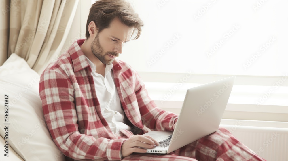 Happy Businessman uses laptop at home, in home clothes, smart working concept, white background, banner, copy space Happy Businessman uses laptop at home, in home clothes, smart working concept, white background, banner, copy space