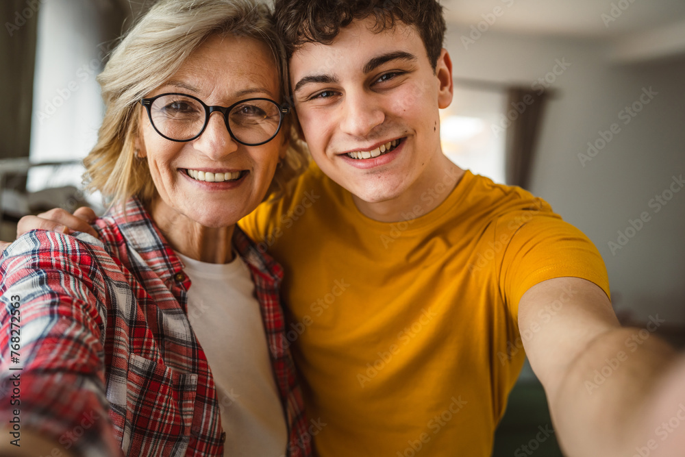 portrait of mother and son mature woman and young man at home happy portrait of mother and son mature woman and young man at home happy