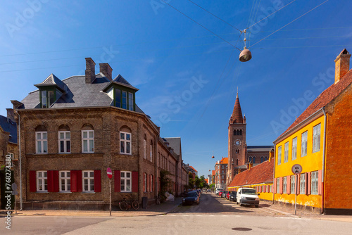 District Nyboder with yellow historic row houses and St Paul Church in Copenhagen, Denmark