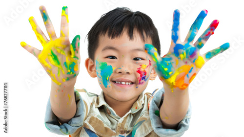 Portrait of a child with hands dirty from paint