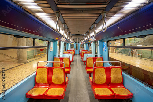 Interior of an empty subway carriage without passengers stopped on an underground station platform. Lisbon, Portugal.03-03-2024