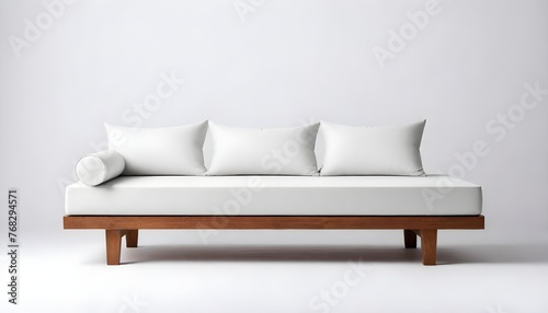 A modern wooden bed frame with a white mattress and a single white pillow against a plain white background, with a black duvet