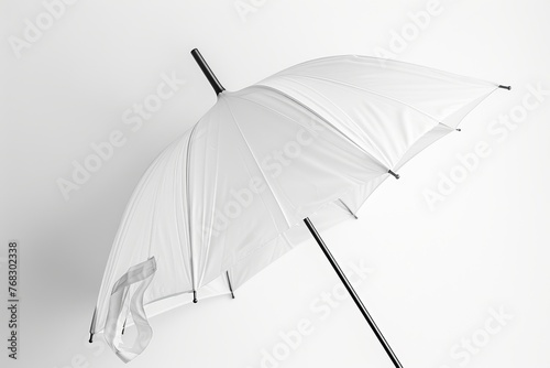 A minimalist photograph featuring a white umbrella against a pure white backdrop highlighting simplicity and elegance photo