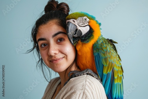 The affection between a young woman and her macaw is palpable in this endearing portrait of togetherness