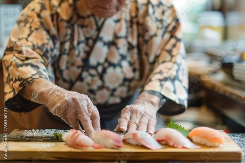 A skilled chef with detailed focus preparing sushi rolls, highlighting the art of Japanese cuisine