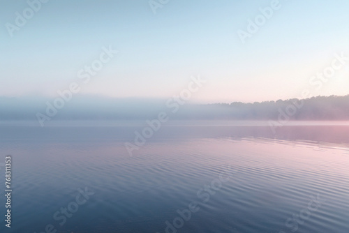 the surface of a calm lake at dawn, capturing the subtle textures of the water with the first light of morning 