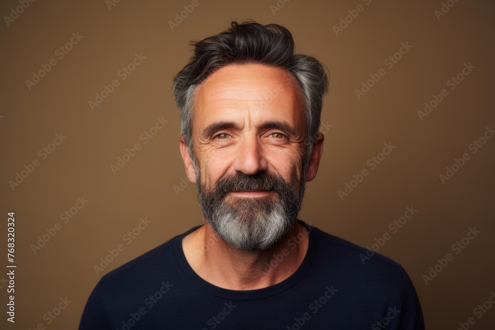 Portrait of a handsome mature man with grey beard and mustache. Portrait of a handsome mature man with grey beard and mustache.