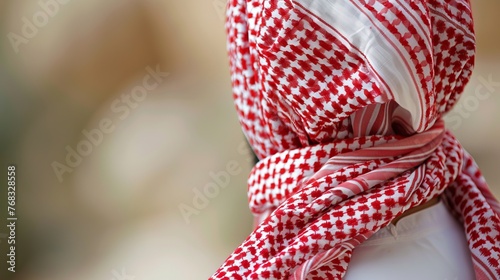 A closeup of the traditional red and white Ghutrah, a headscarf worn by oriental men photo