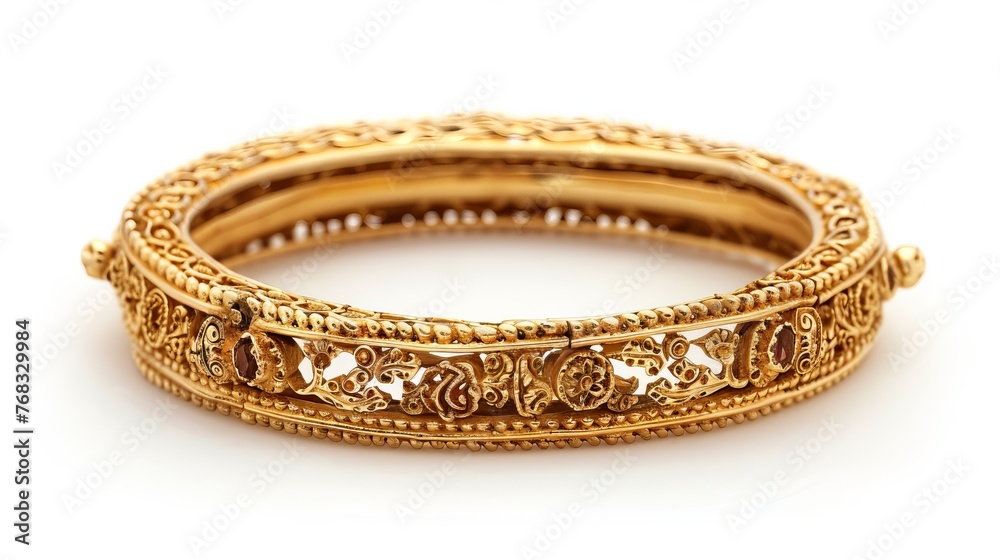 An elegant Indian design gold bangle, showcased in isolation against a white background An elegant Indian design gold bangle, showcased in isolation against a white background