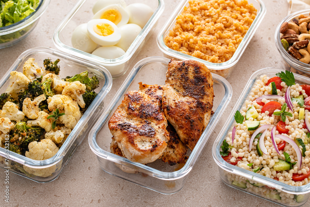 Healthy meal prep with cooked chicken breast, boiled eggs, roasted vegetables, cooked lentils, couscous salad and nuts Healthy meal prep with cooked chicken breast, boiled eggs, roasted vegetables, cooked lentils, couscous salad and nuts