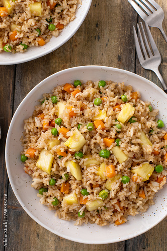 Vegan fried rice with pineapple, carrots and peas, balanced vegan meal