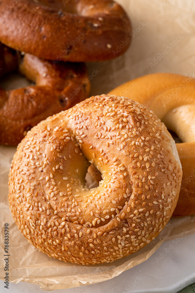 Freshly baked bagels ready to eat for breakfast, sesame, cinnamon and plain Freshly baked bagels ready to eat for breakfast, sesame, cinnamon and plain