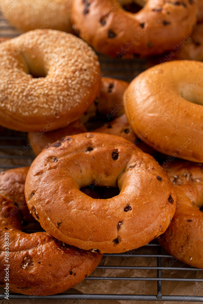 Freshly baked bagels ready to eat for breakfast, sesame, cinnamon and plain Freshly baked bagels ready to eat for breakfast, sesame, cinnamon and plain
