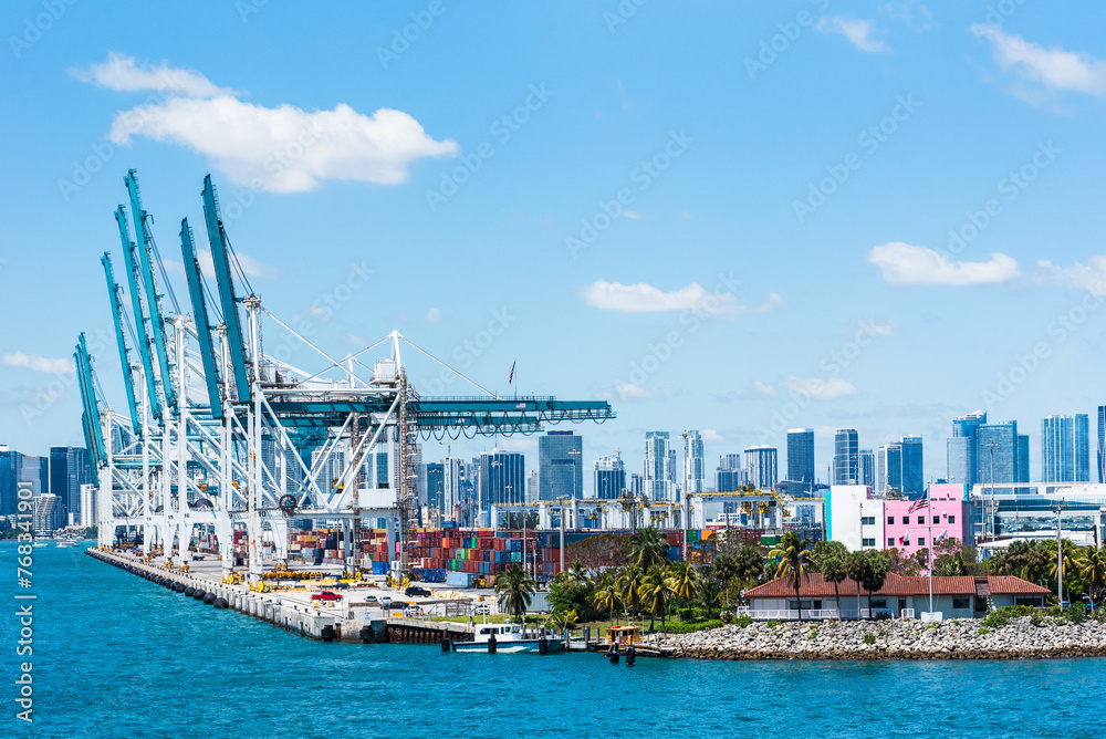 Panorama view on the Miami sea port container terminal with gantry cranes waiting for the cargo container ship.