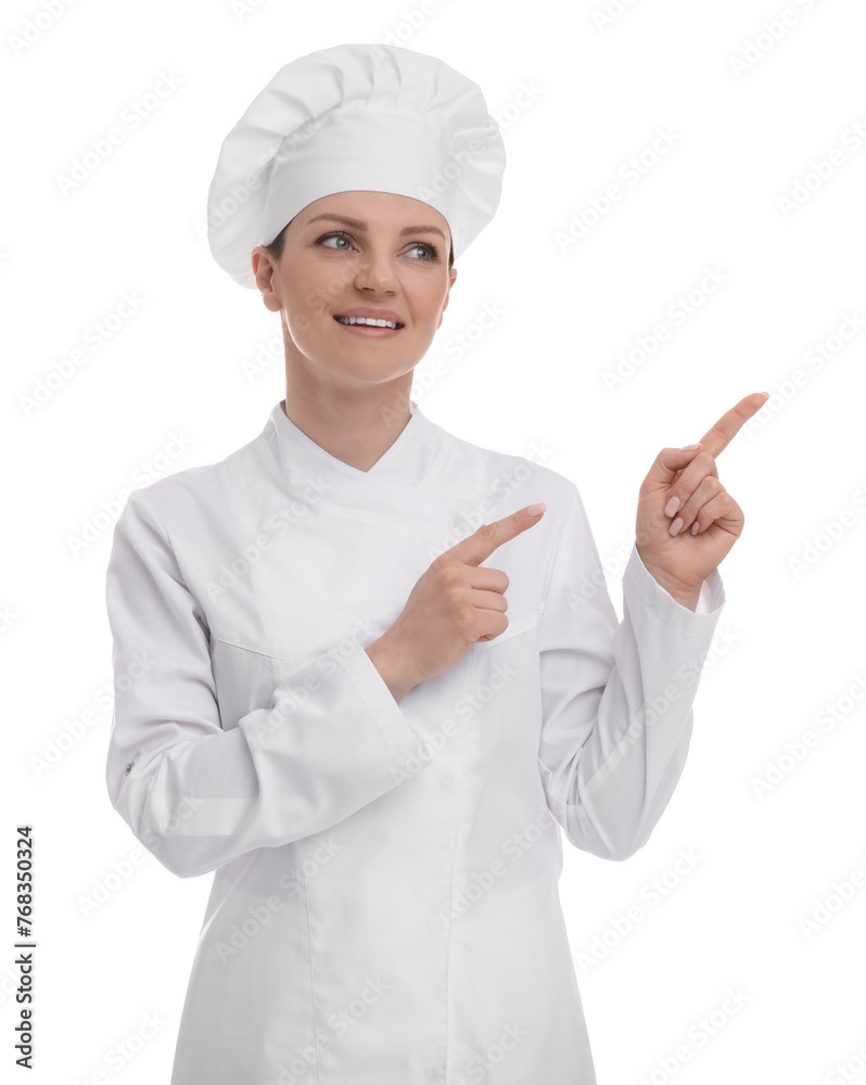 Happy woman chef in uniform pointing at something on white background Happy woman chef in uniform pointing at something on white background