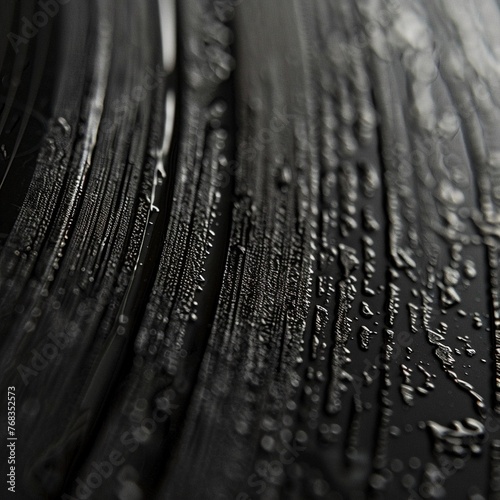 Closeup photograph of the grooves on a vinyl record, highlighting the precision and patterns low texture