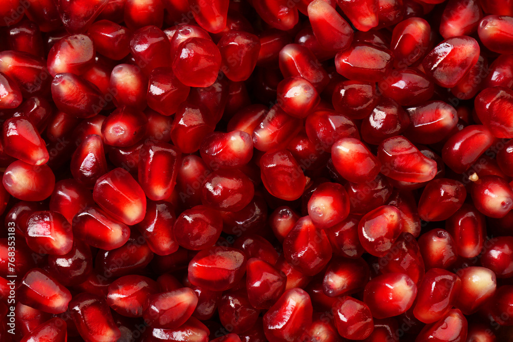 Ripe juicy pomegranate grains as background, top view Ripe juicy pomegranate grains as background, top view