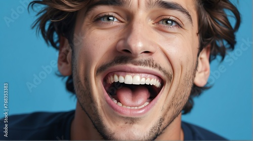 young italian man on plain bright blue background laughing hysterically looking at camera background banner template ad marketing concept from Generative AI