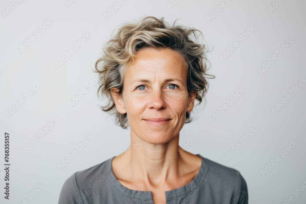 Portrait of a beautiful middle-aged woman with short hair. Portrait of a beautiful middle-aged woman with short hair.