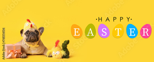 Cute French bulldog in chick hat with gift box and toys on yellow background. Easter celebration