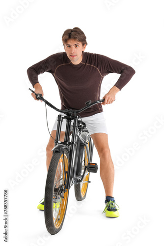 Young male cyclist riding b...